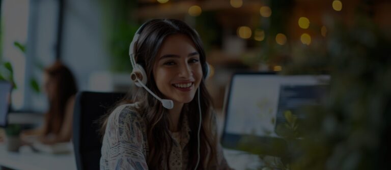 A call center agent at desk assisting customer over the phone